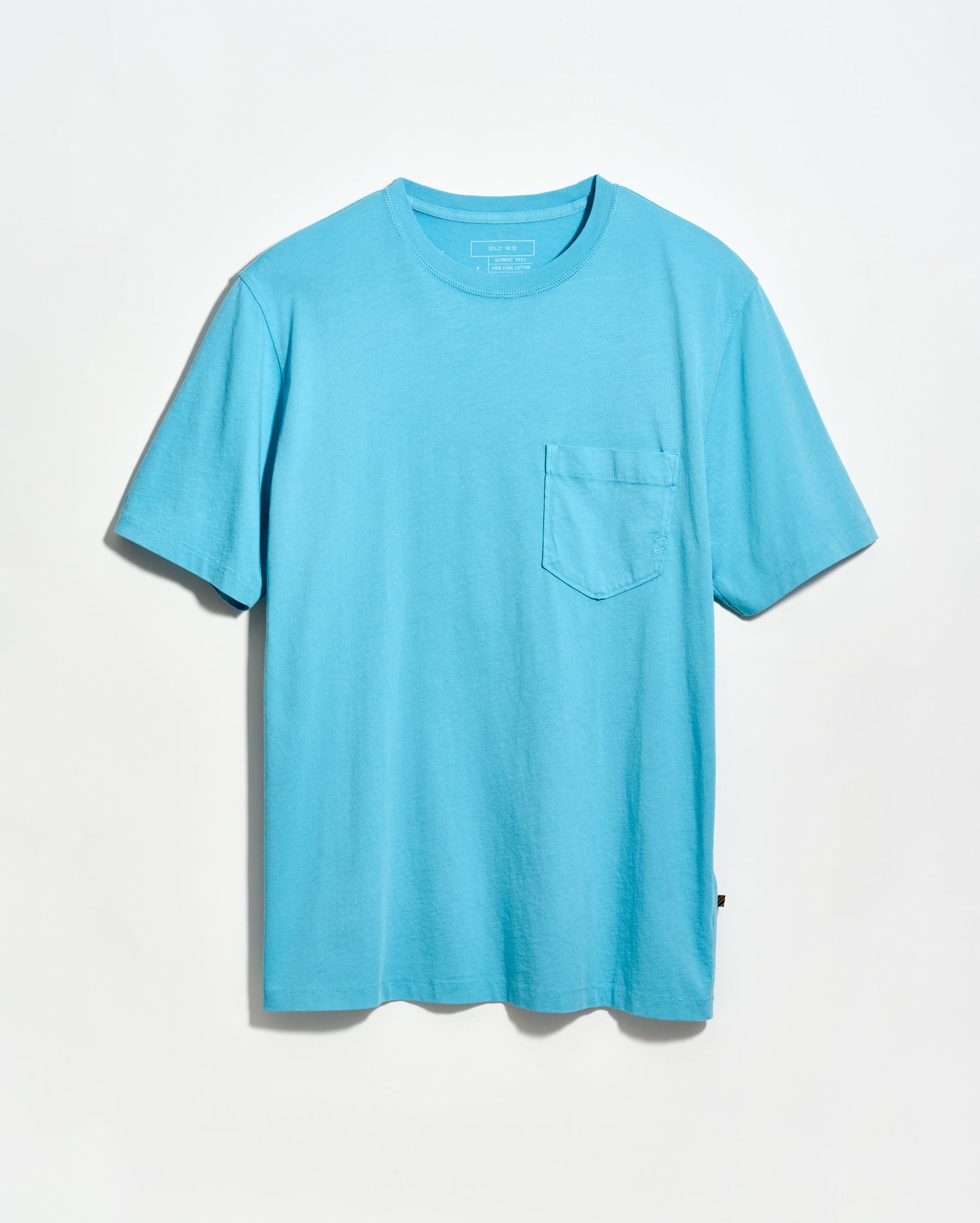 Blue t-shirt with a pocket on a light gray background