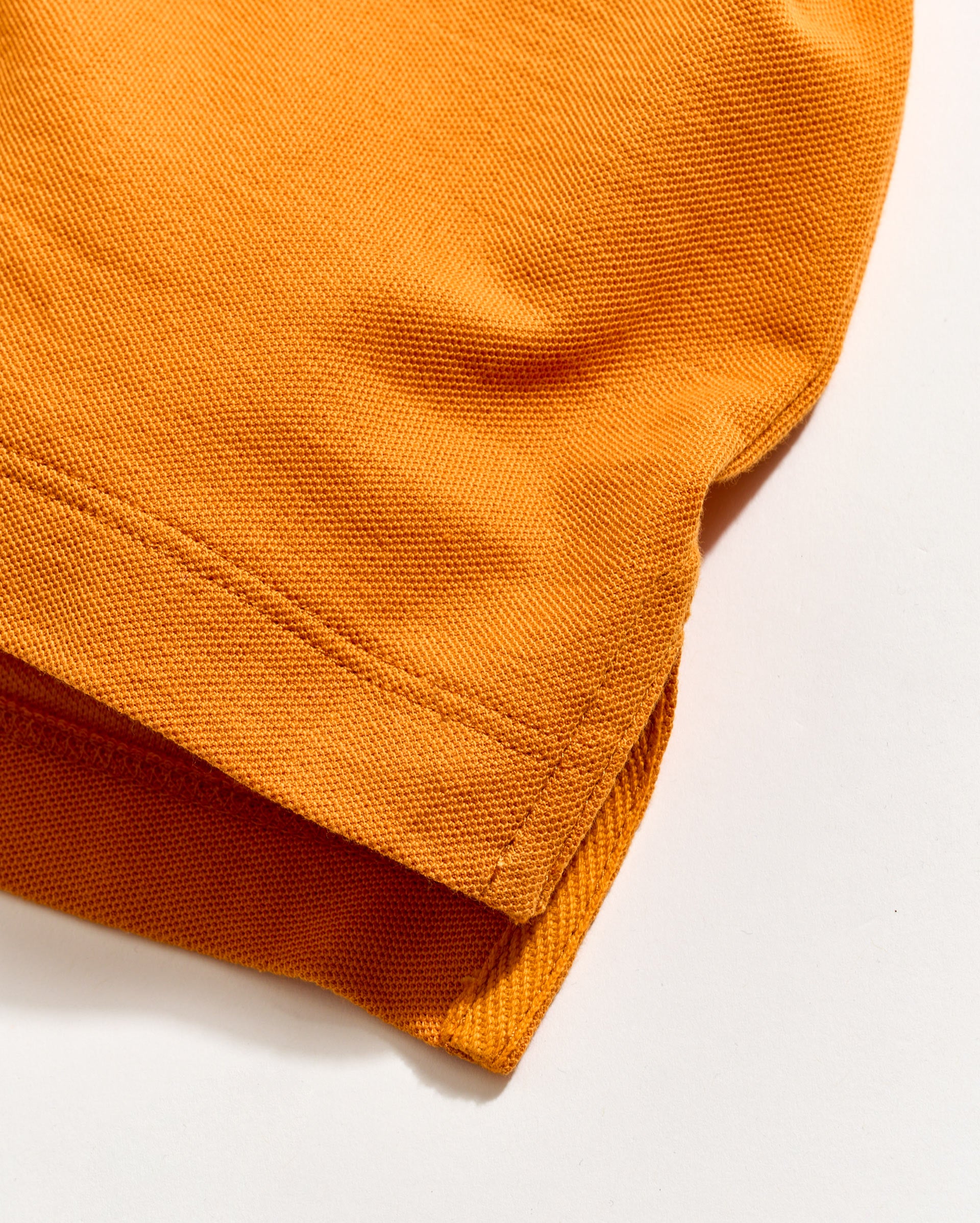 Close-up of orange fabric on a white background