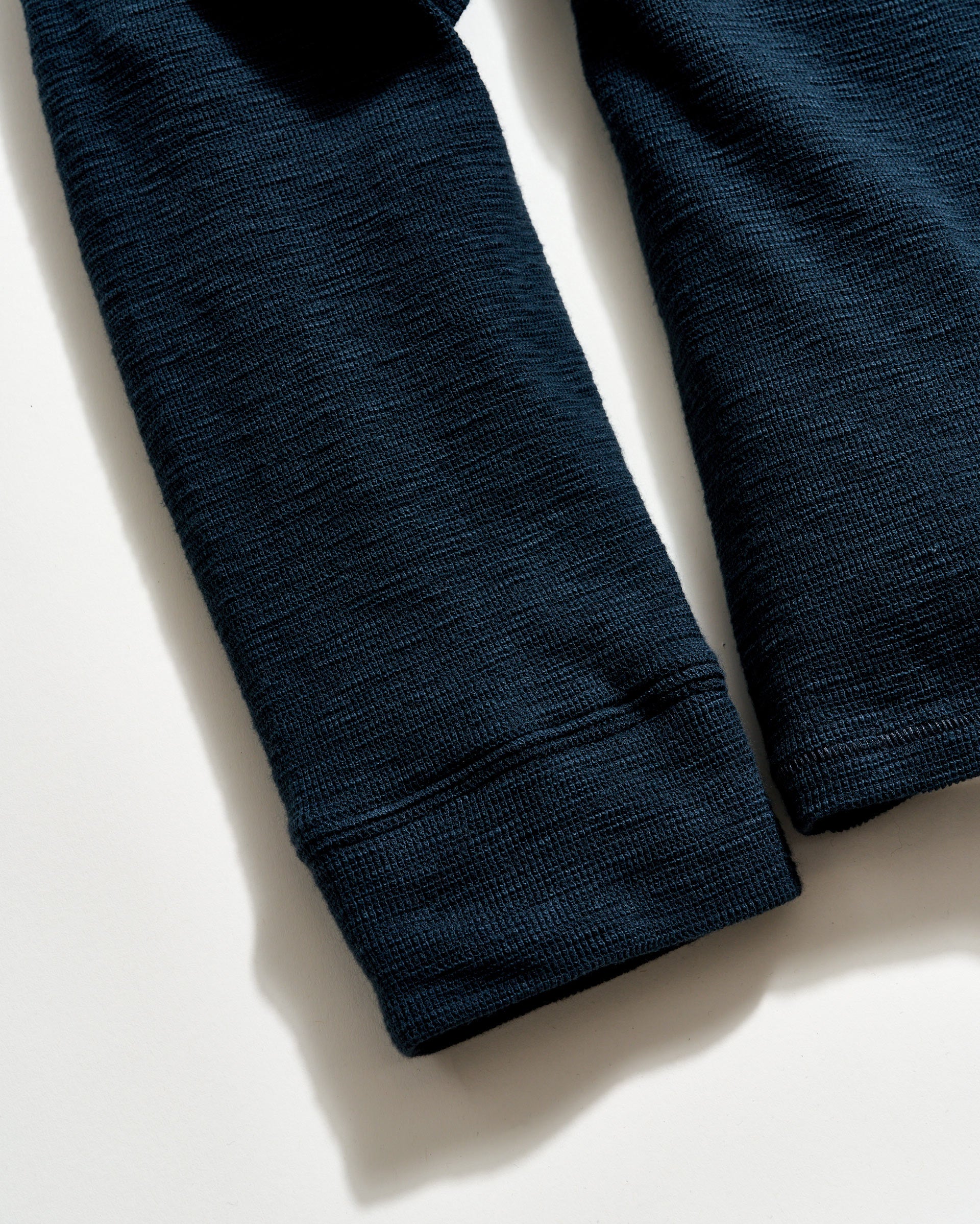 Dark blue textured fabric on a light background