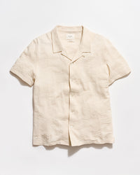 Beige linen shirt on a white background