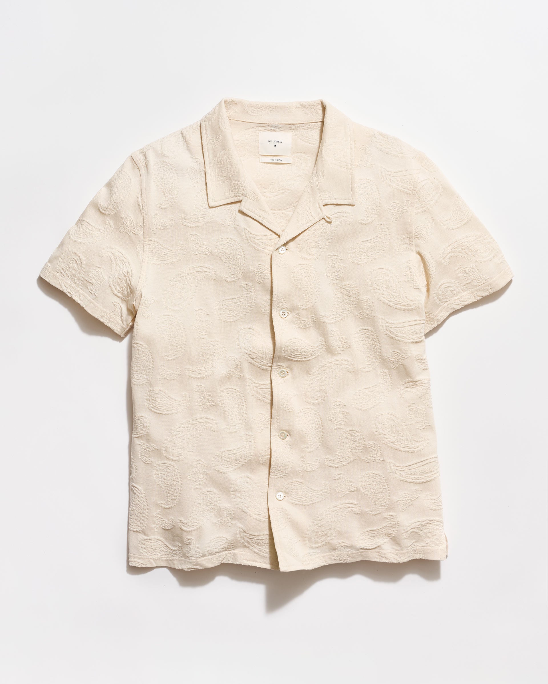 Beige linen shirt on a white background
