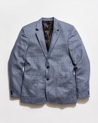 Blue checkered blazer on a light gray background