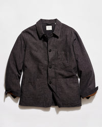 Dark gray jacket with button details on a light gray background