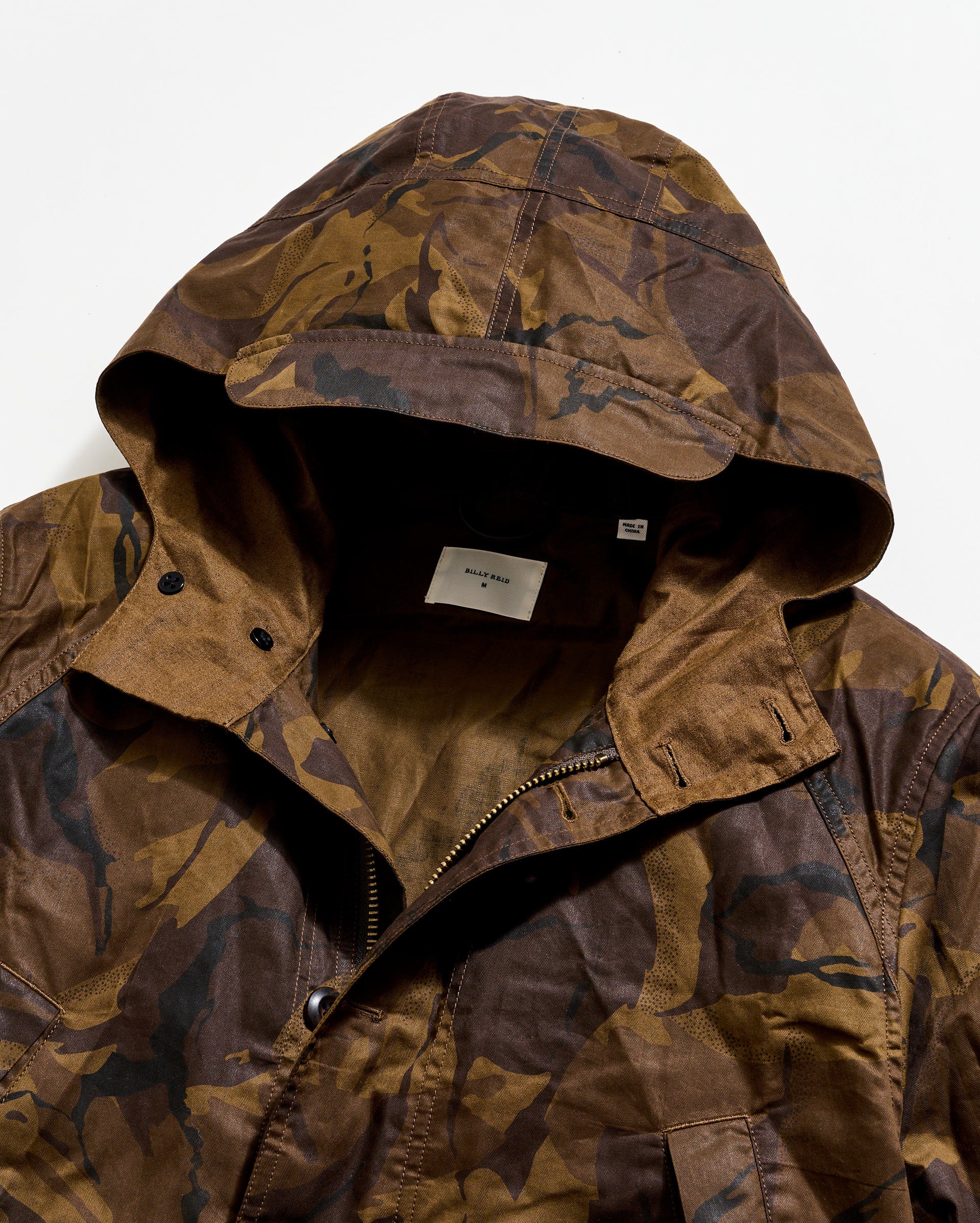 Camouflage jacket with a hood on a white background