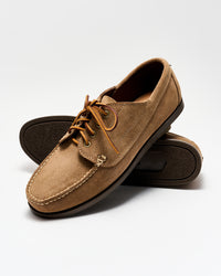 Pair of brown leather shoes on a white background