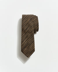 Striped tie on a light gray background