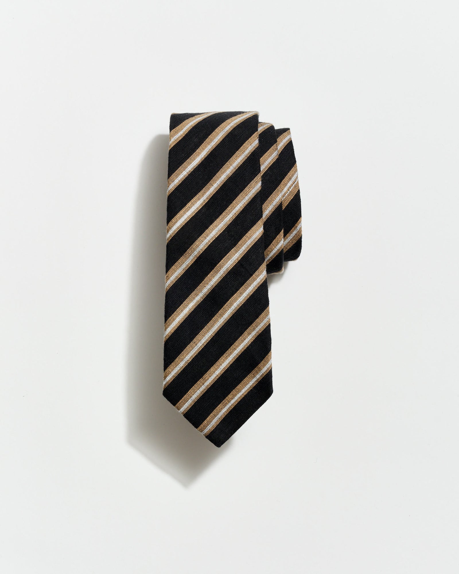 Black and beige striped tie on a light gray background