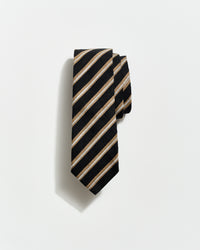 Black and beige striped tie on a light gray background