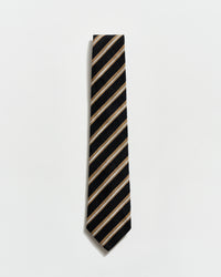 Black and beige striped tie on a light gray background
